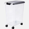 Clear plastic dog food storage container with locking lid and rolling wheels