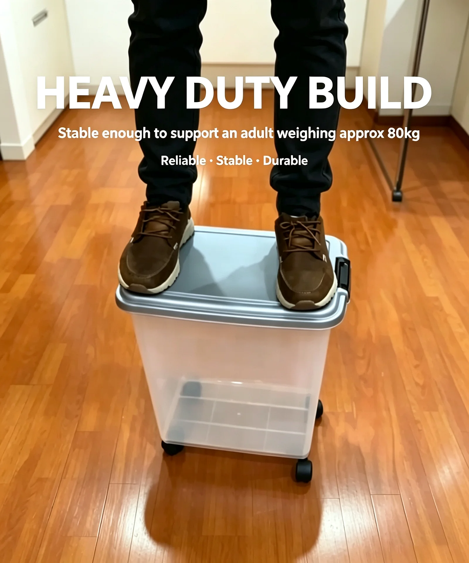 Clear wheeled pet food storage container with gray lid and black latches, shown with an adult standing on the lid to demonstrate sturdiness