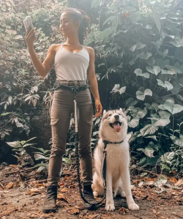 Woman walking a large dog using a hands-free dog leash
