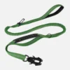 Green tactical rope dog leash with a padded handle, bungee section and metal clasp, displayed to show grip and flexibility