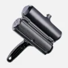 Black dog hair remover roller on plain white background