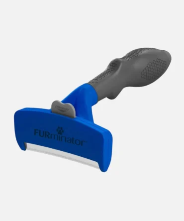 Blue and grey dog deshedding tool against plain light background